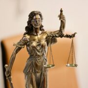 Close up of Lady Justice statue holding scales, symbolizing justice and fairness