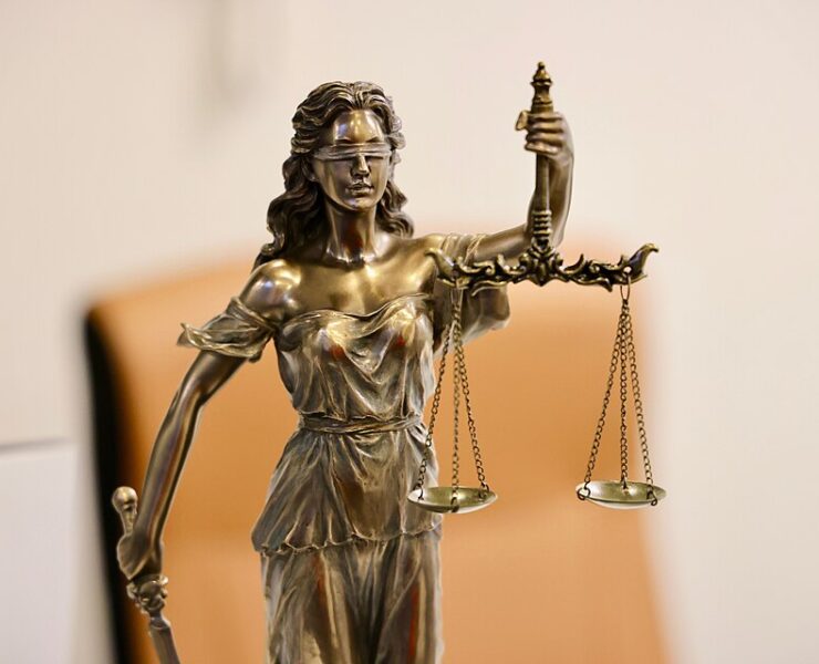 Close up of Lady Justice statue holding scales, symbolizing justice and fairness